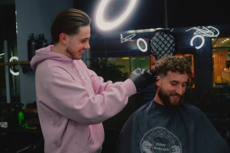 Matt Henebery cutting a clients hair at Jimmy Marum's twickenham.